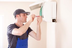 technician-installing-ductless-air-handler