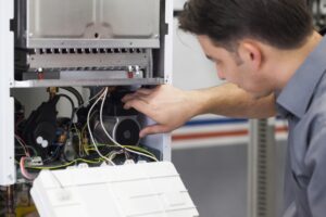 technician-doing-repairs-on-a-heater