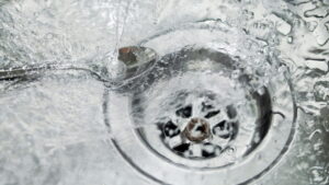 water-swirling-down-a-kitchen-sink-drain