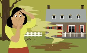 person-holding-nose-near-smelly-backyard-puddle